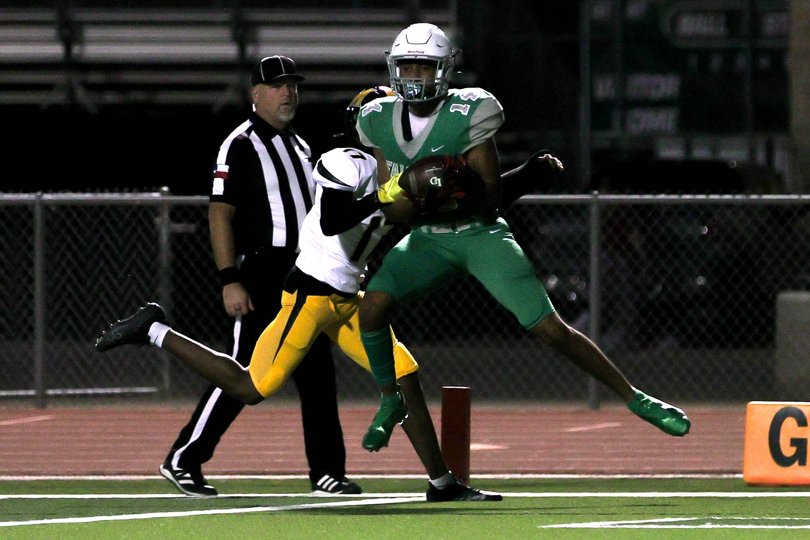 Lake Dallas wide receiver Evan Weinberg (14) comes up with touchdown reception against...