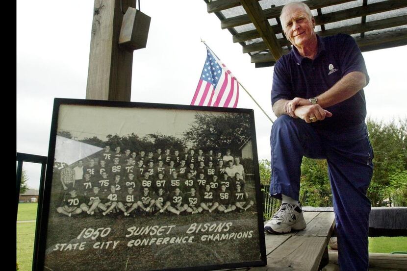 Joe Boring poses with a photo the Sunset High School state football champions in 1950. Joe...