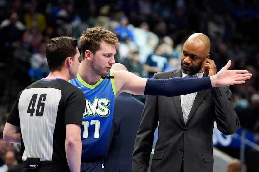 Dallas Mavericks guard Luka Doncic (77) argues with a referee during the second half of an...