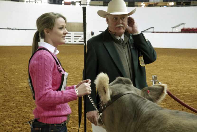 Jessica Johnston with the Broken Oak Ranch out of Seguin and Livestock Superintendent Mike...