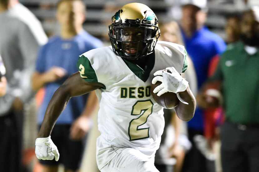 DeSoto senior wide receiver Jamal Brown (2) catches a pass from DeSoto senior quarterback...