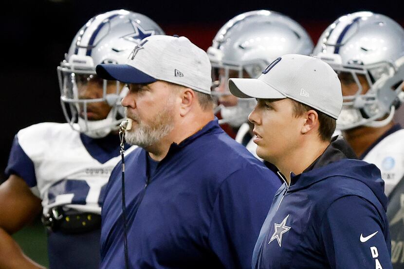 Dallas Cowboys head coach Mike McCarthy (left) and offensive coordinator Kellen Moore watch...