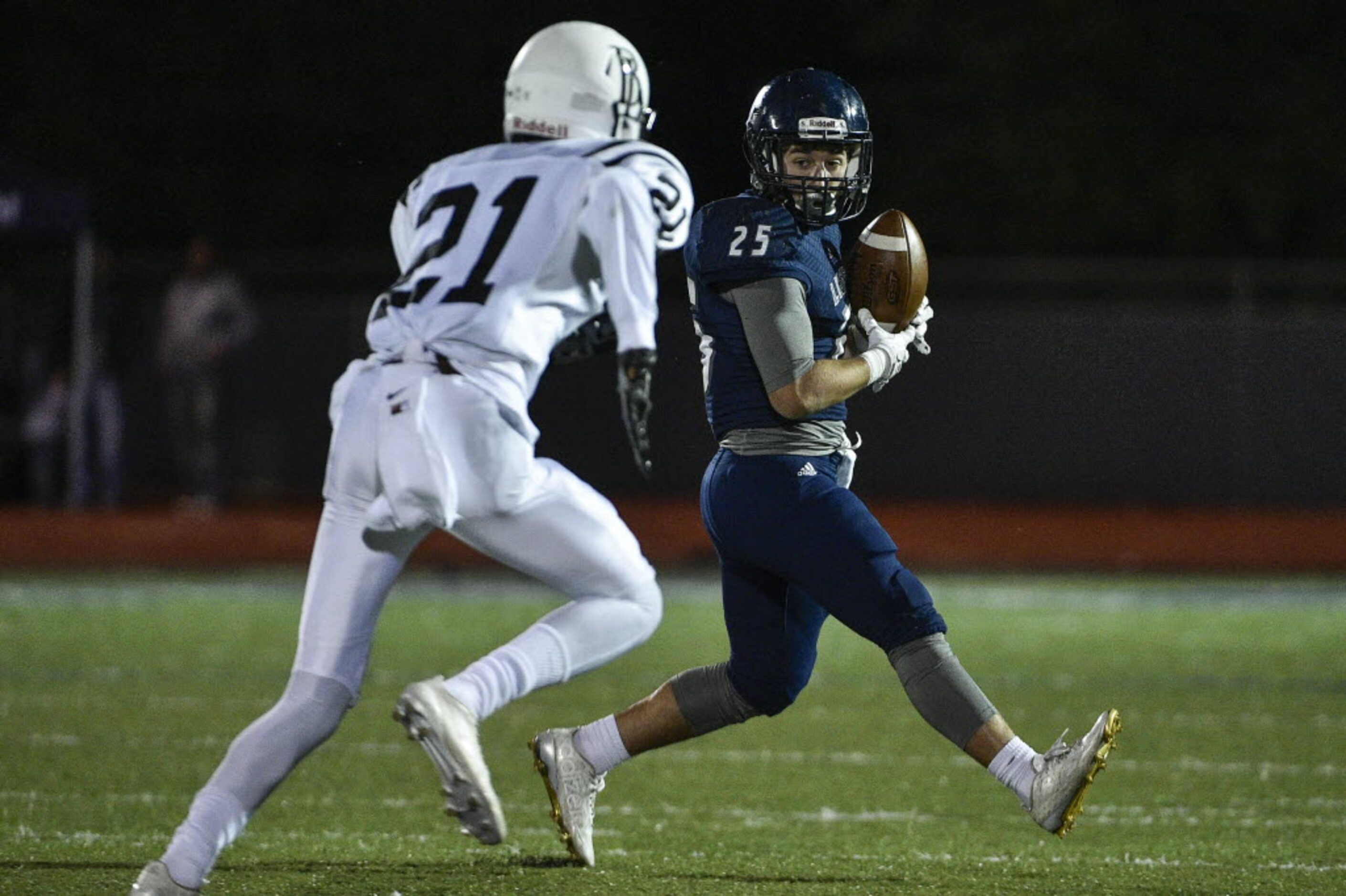 Liberty running back Ryan Vollenhals (25) catches a pass in front of Bishop Lynch corner...