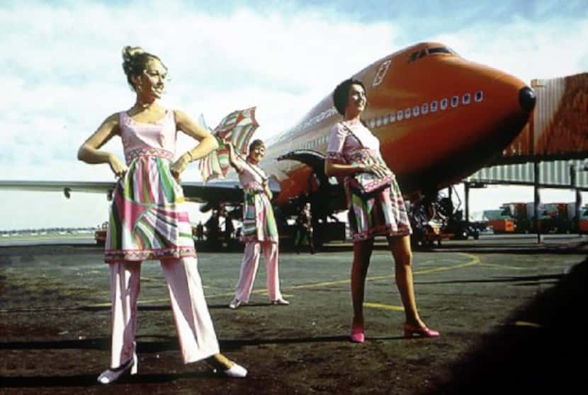 Braniff flight attendants model their Pucci uniforms on the tarmac. 