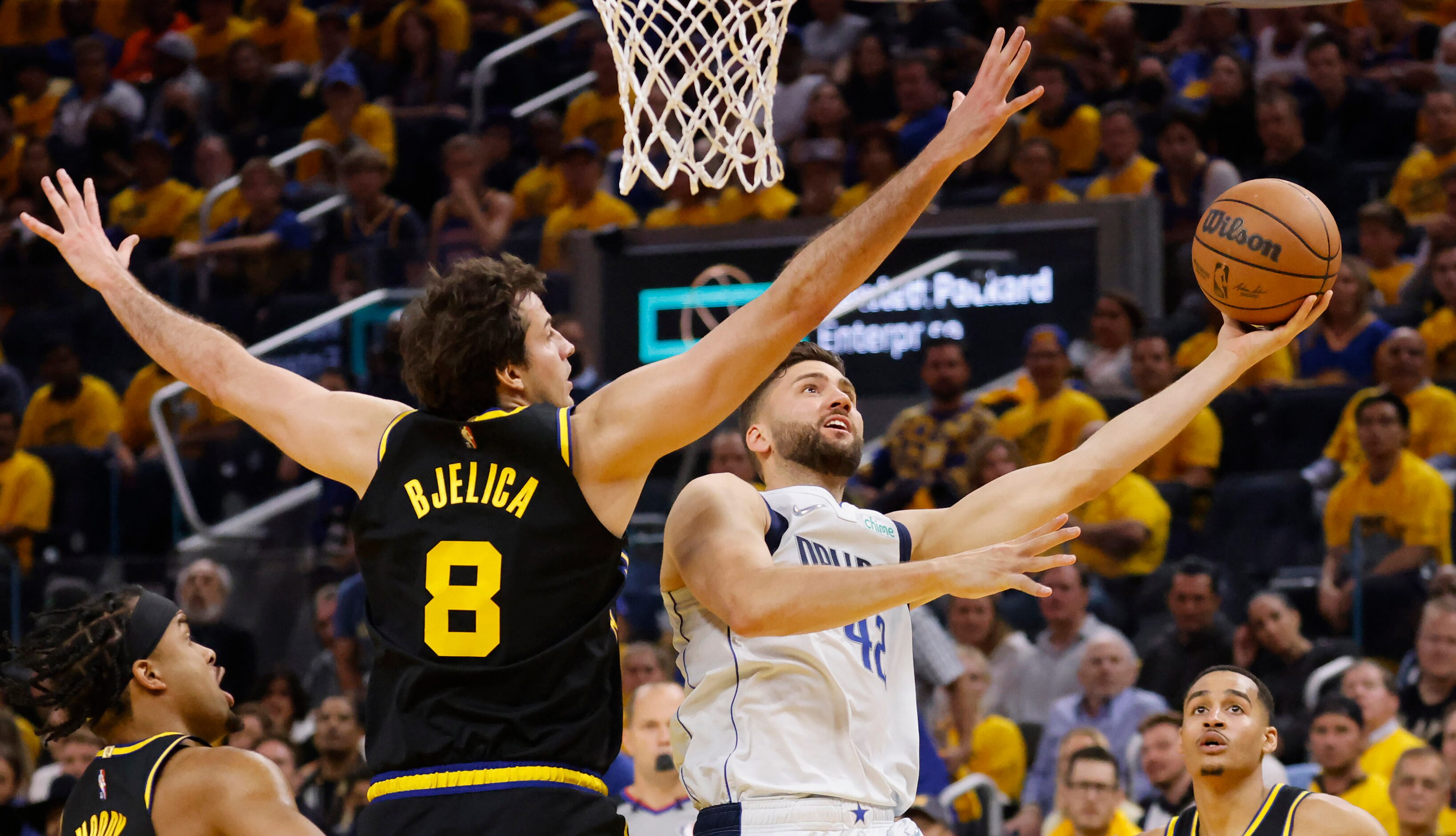 Dallas Mavericks forward Maxi Kleber (42) lays up a shot against Golden State Warriors...