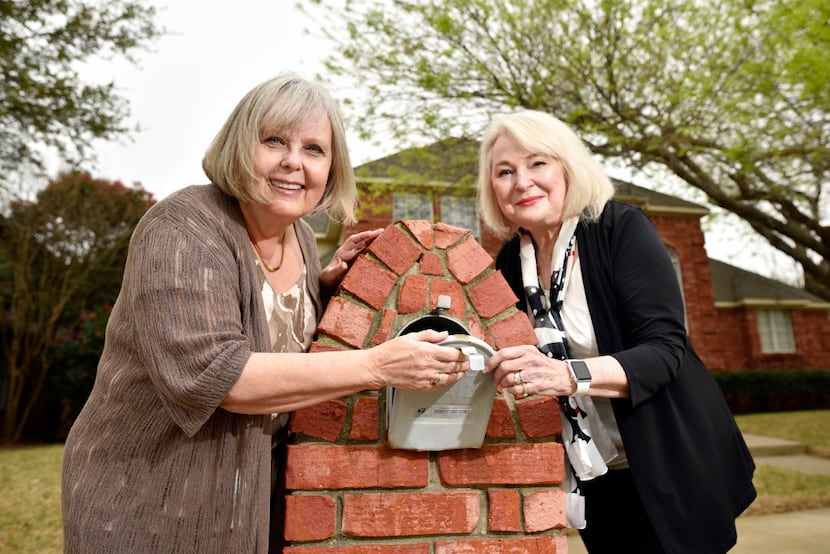 Mary Sarao, left, and Barbara Pitts, are shown next to Barbara's mailbox outside her home in...