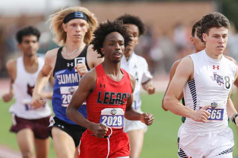 Mansfield Legacy's Jabari Mitchell (front left) and Denton Ryan's Jackson Parrish (front...