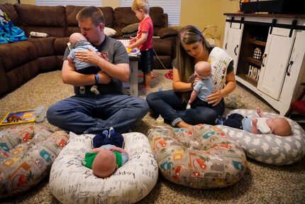 Chris and Katie Sturm fed quadruplets (from left) Jacob, Austin, Daniel and Hudson, who were...