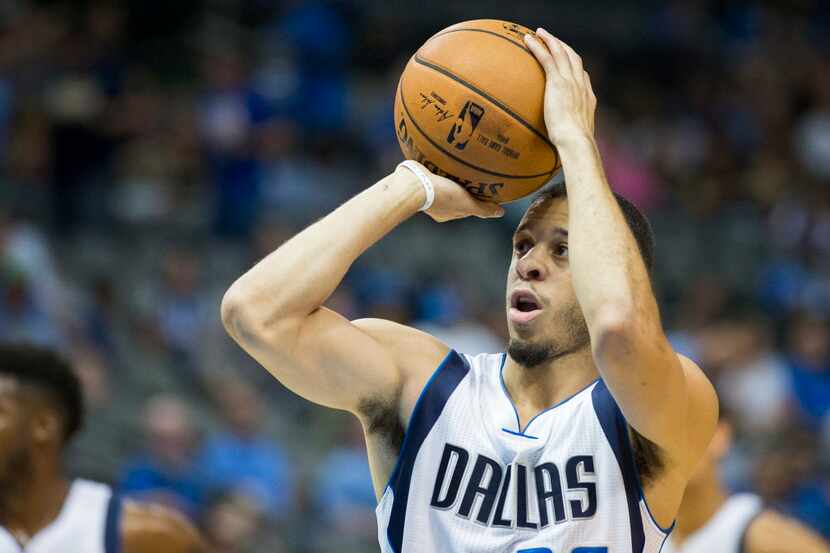 Dallas Mavericks guard Seth Curry shoots a free throw during the first half of an NBA...