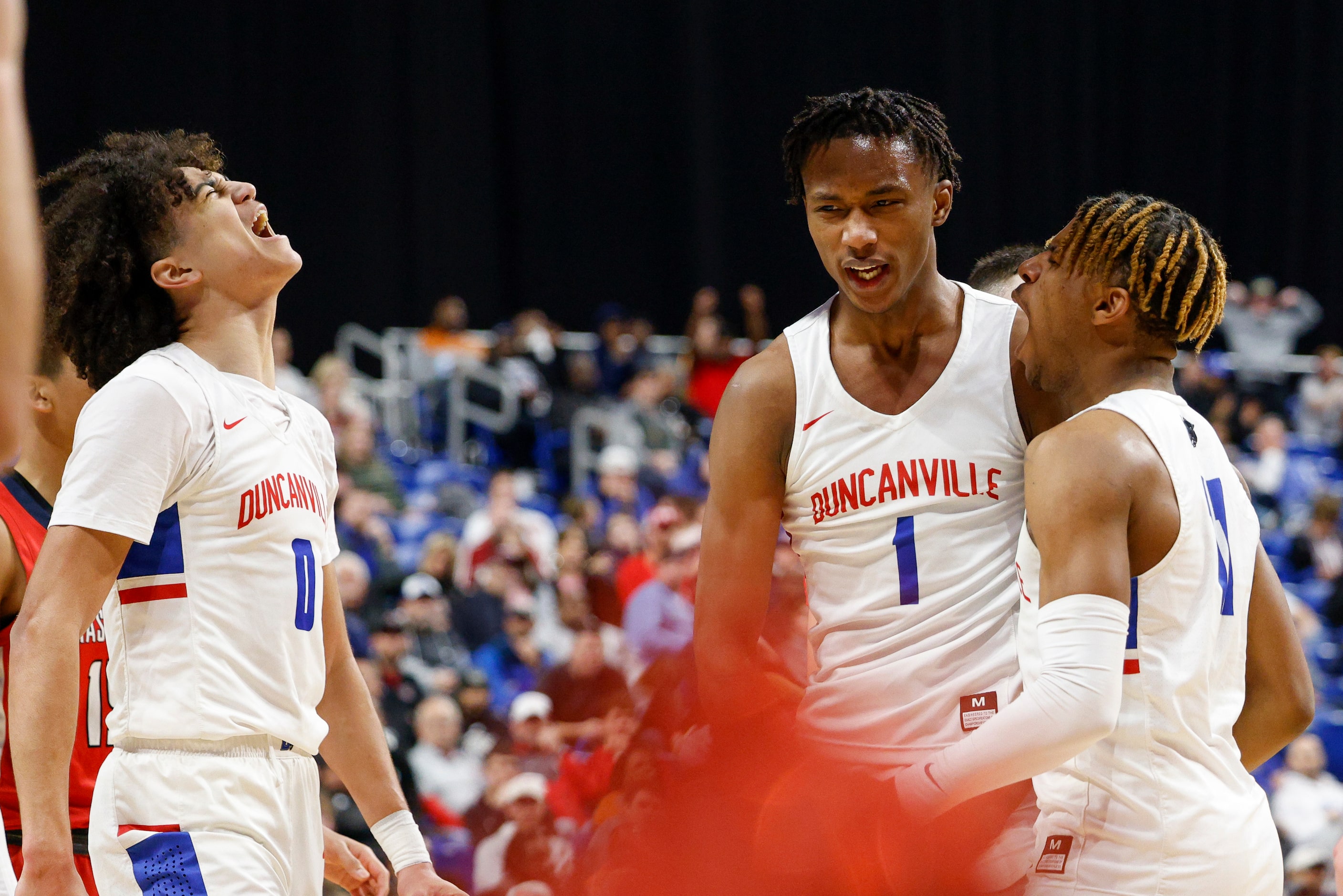 Duncanville guard Anthony Black (0), Duncanville forward Ron Holland (1) and Duncanville...