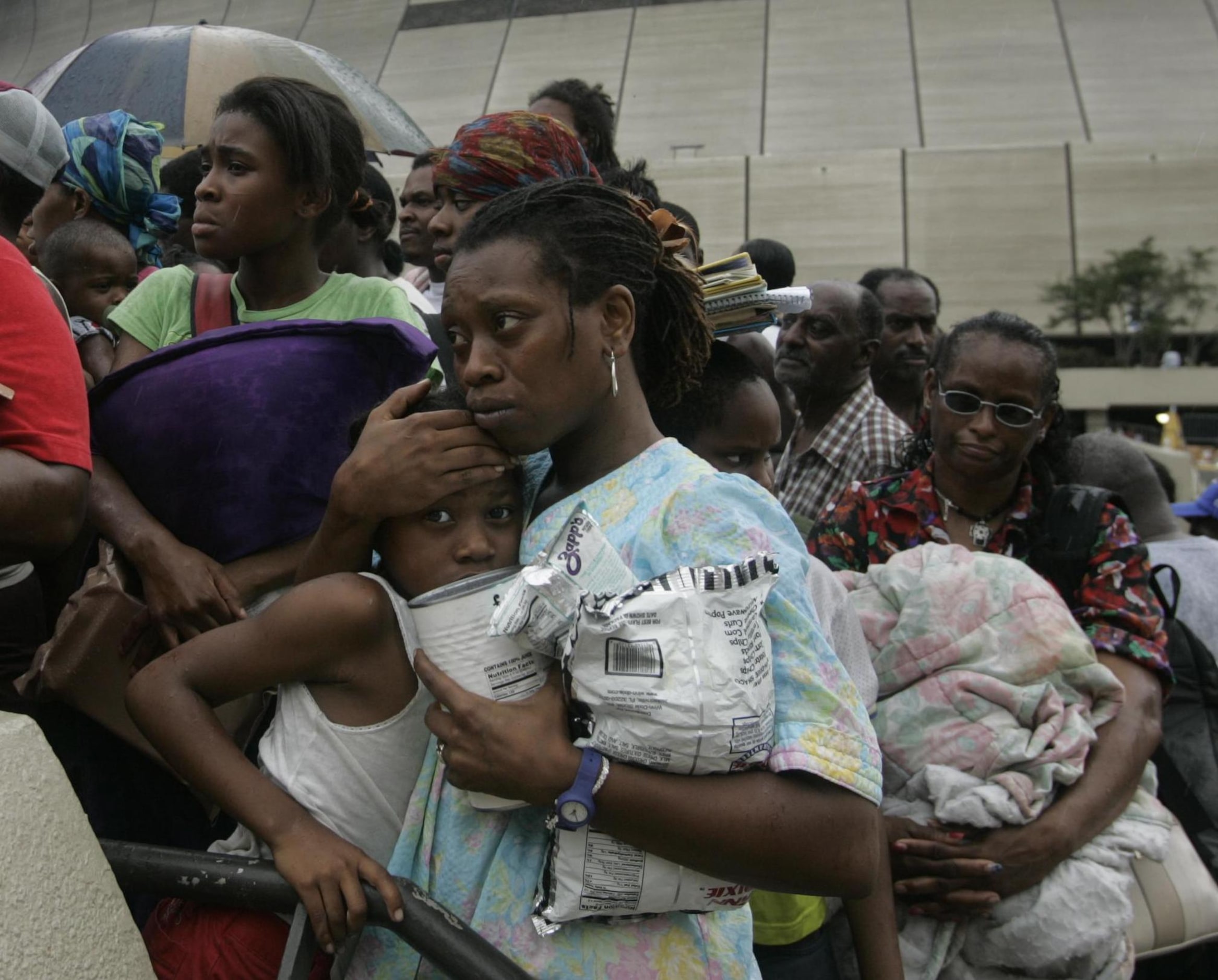 Dejon Fisher, 8, waited fearfully with Cavel Fisher Clay, 33, and Alexis Fisher, 14, in a...