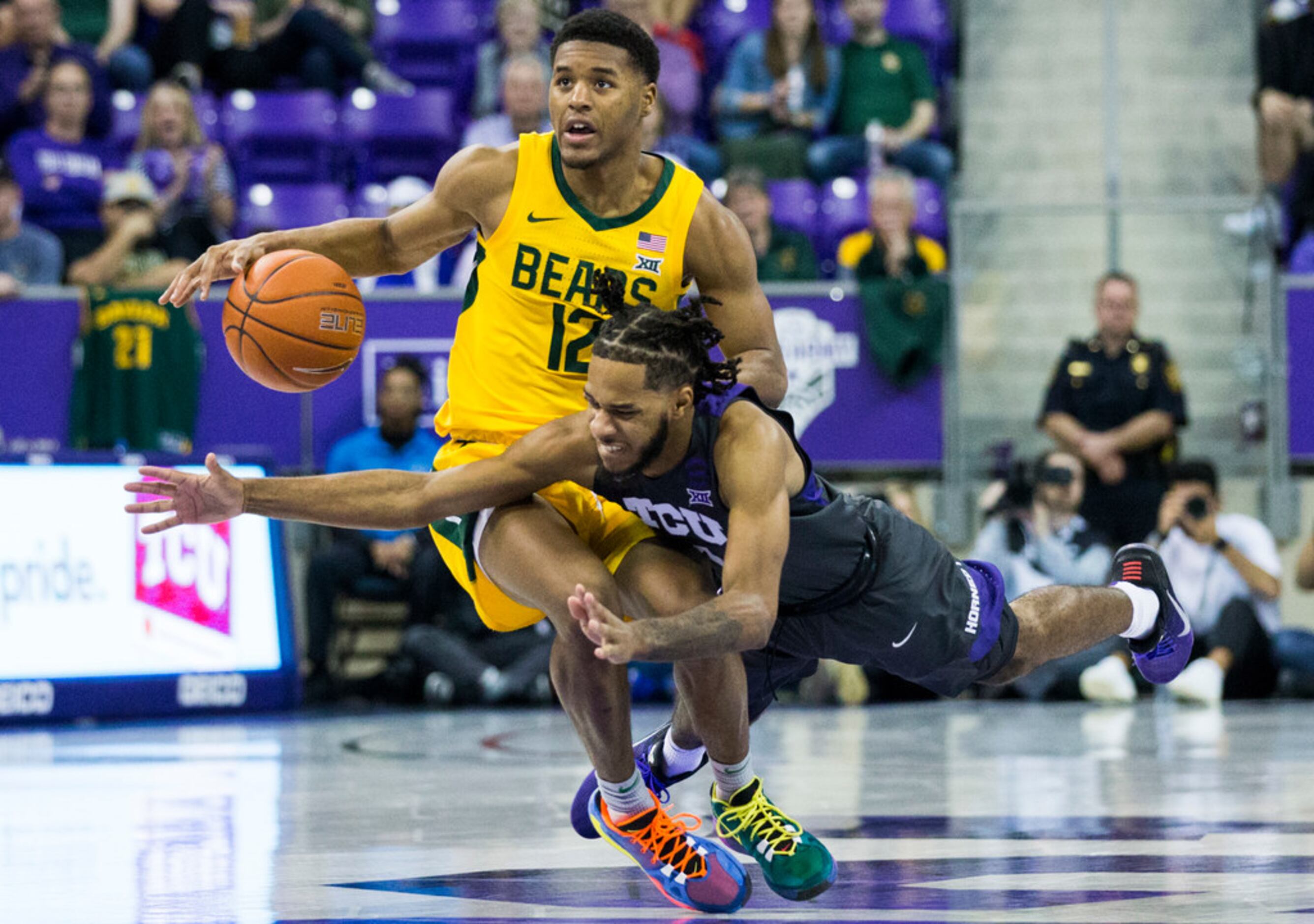 TCU Horned Frogs guard PJ Fuller (4) tries to take control of a loose ball from Baylor Bears...