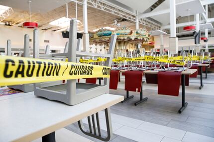 Wrapped in caution tape, the sit-in dining area of the food court was closed Friday at...