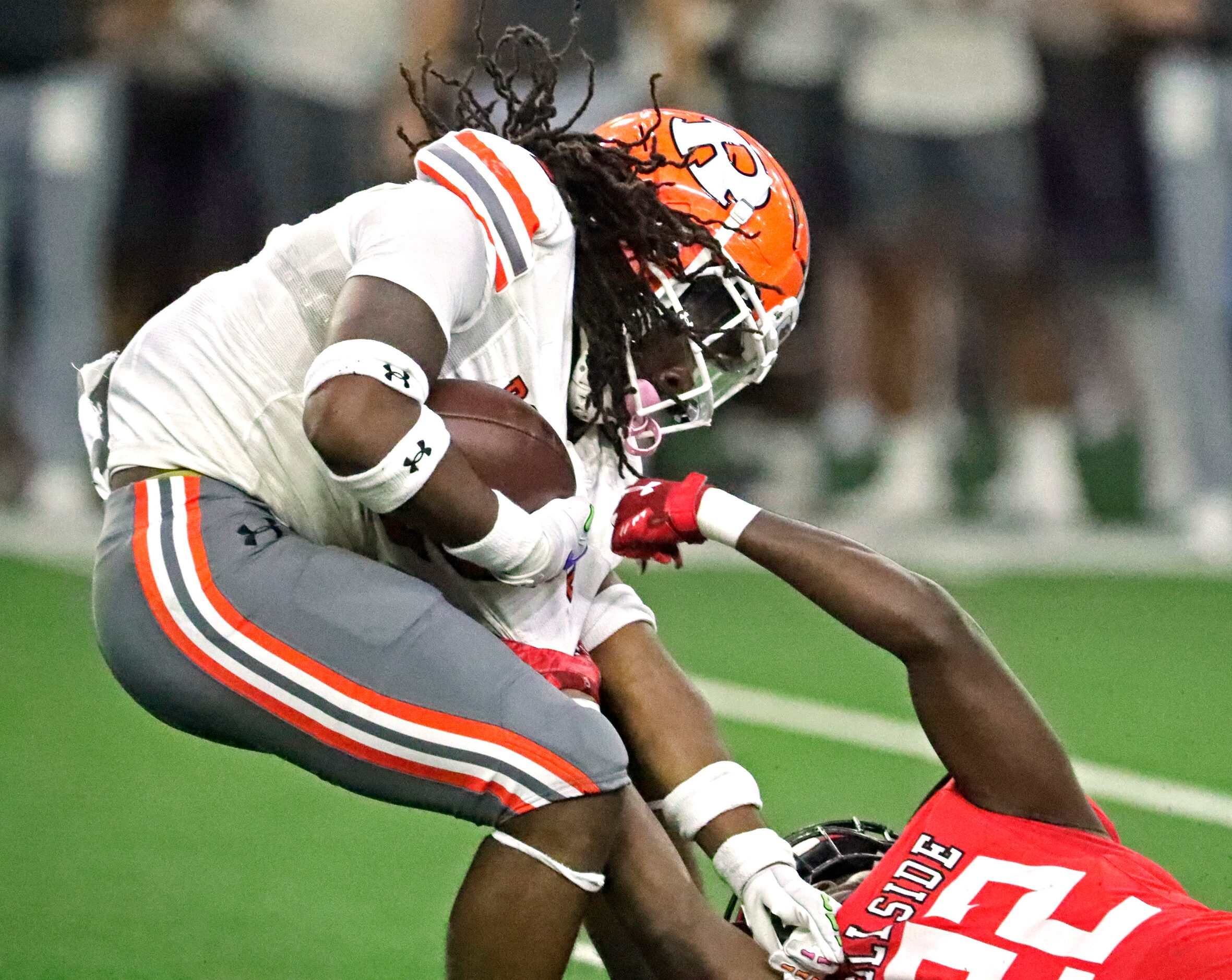 Rockwall High School running back Ashten Emory (2) is brought down by Cedar Hill High School...