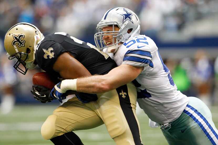 Dallas Cowboys inside linebacker Dan Connor (52) tackles New Orleans Saints running back...