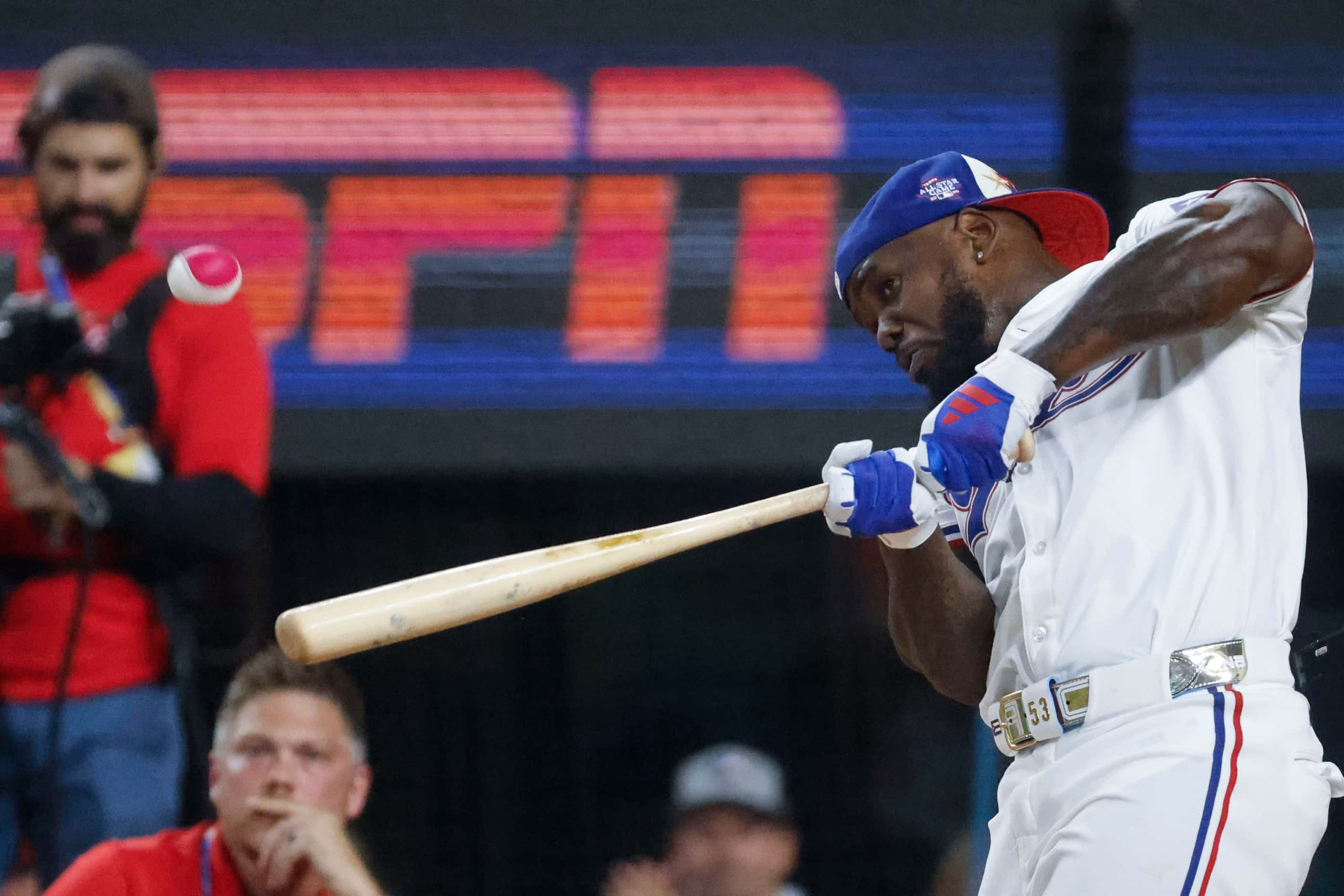 Adolis Garcia of the Texas Rangers hits for a home run during the first round of MLB...