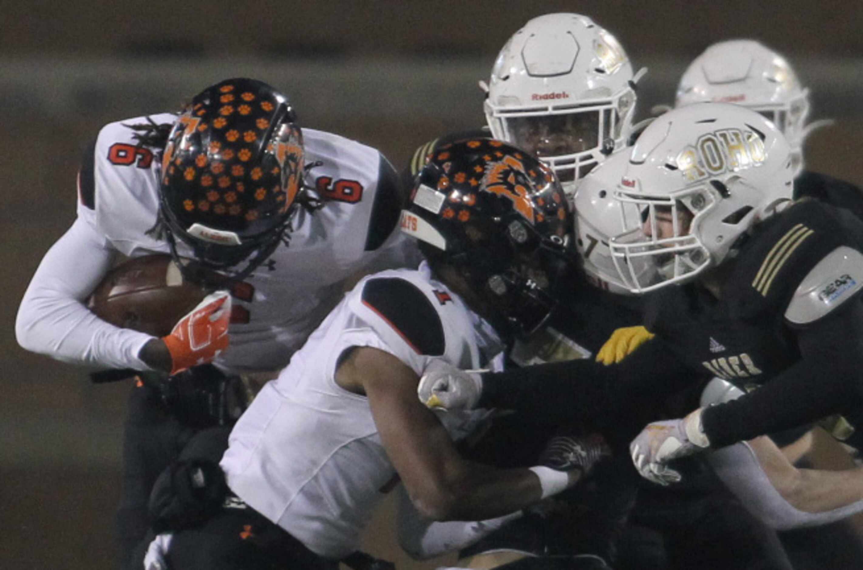 Aledo running back Demarco Roberts (6) puts his head down and bulls his way for a rushing...