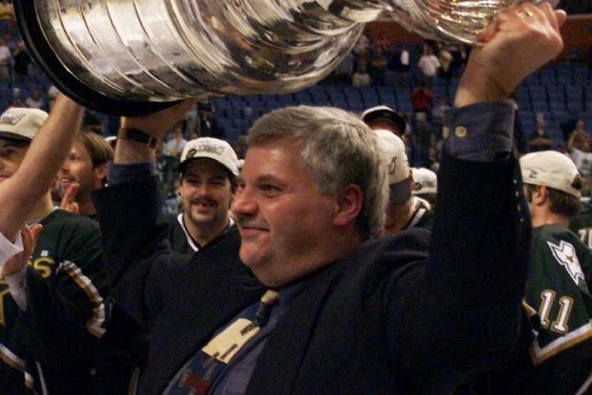 FILE - In this June 20, 1999, file photo, Dallas Stars coach Ken Hitchcock hoists the...