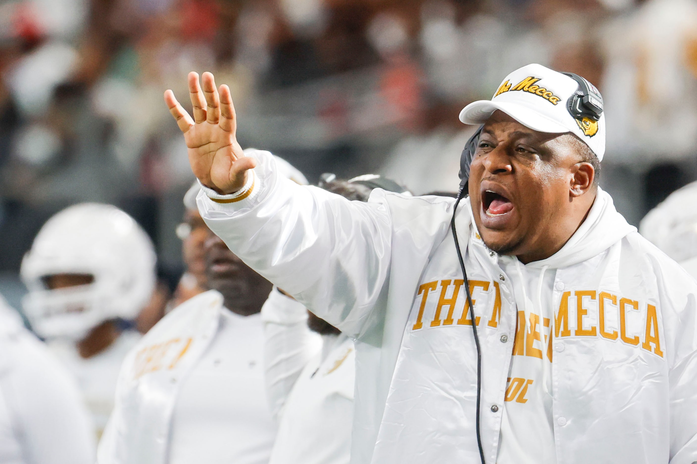 South Oak Cliff head coach Jason Todd instructs his team during the first half of Class 5A...