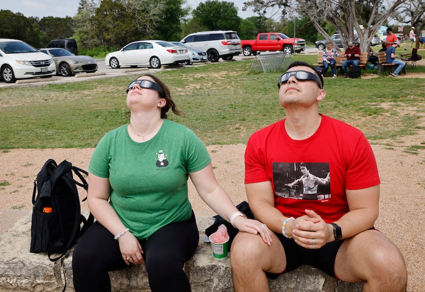 Alma Villatoro of Spring, Texas, and her husband, Richard Deleon, watched the total solar...