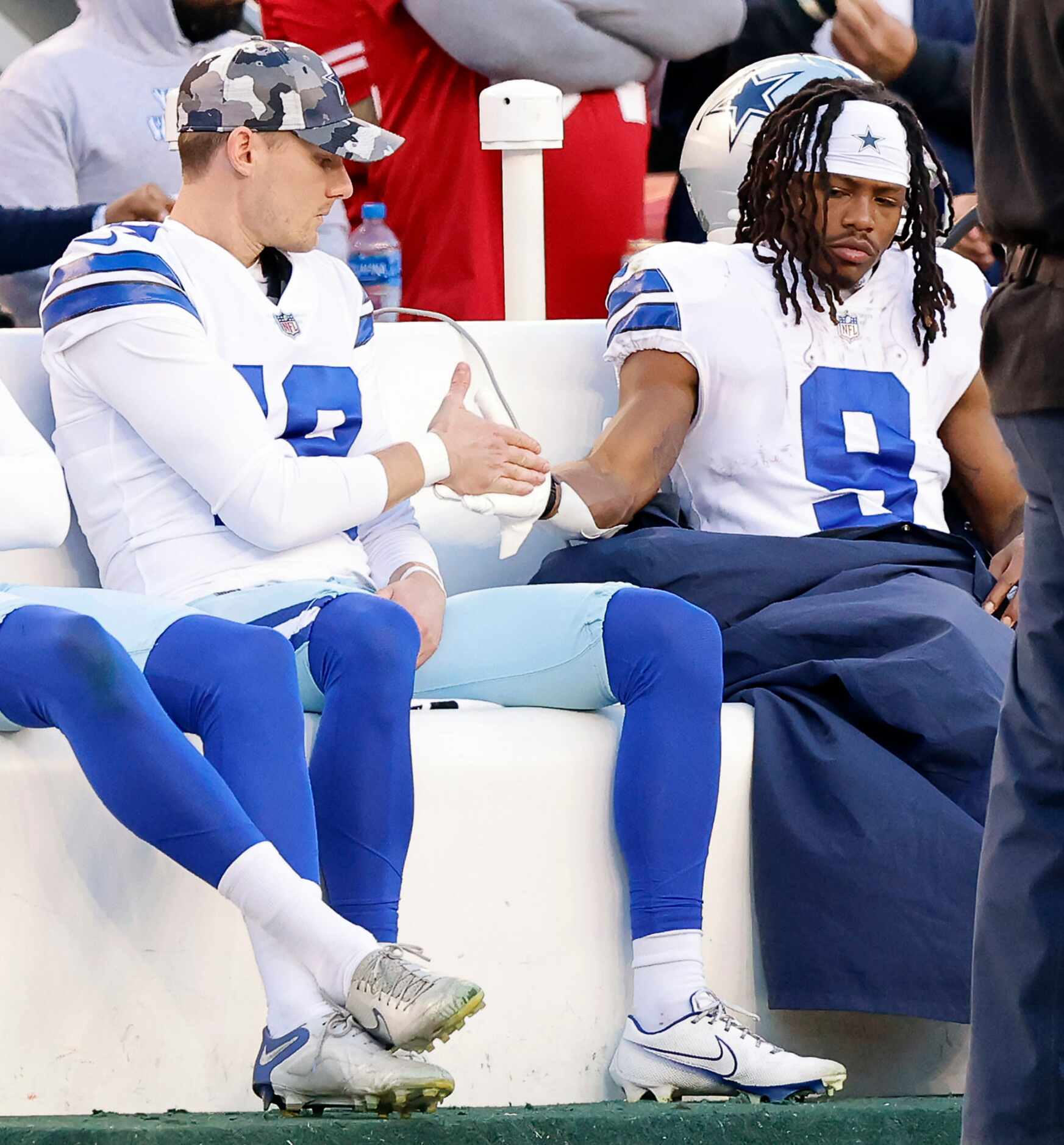 Dallas Cowboys wide receiver KaVontae Turpin (9) slaps hands with place kicker Brett Maher...