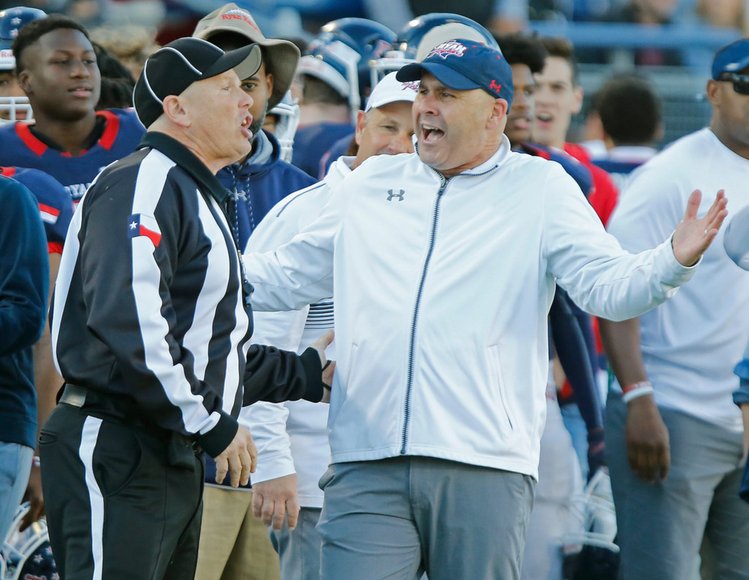 Denton Ryan High School head coach Dave Henigan argues an interference call late in the...