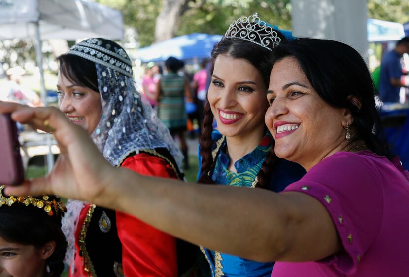 Banoo Irani, center, and Hajar Saufi, right, pose for a selfie before representing Iran in a...