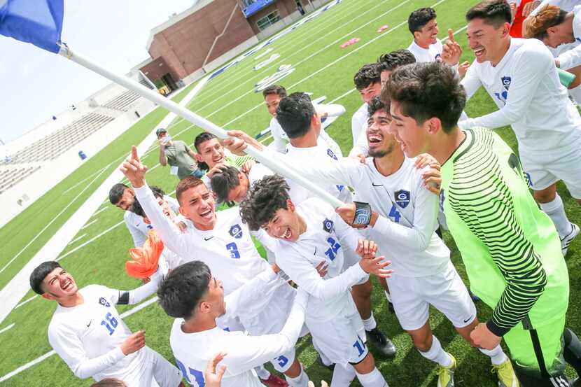 Grand Prairie players celebrate their 1-0 win against Sam Houston in a Class 6A Region I...