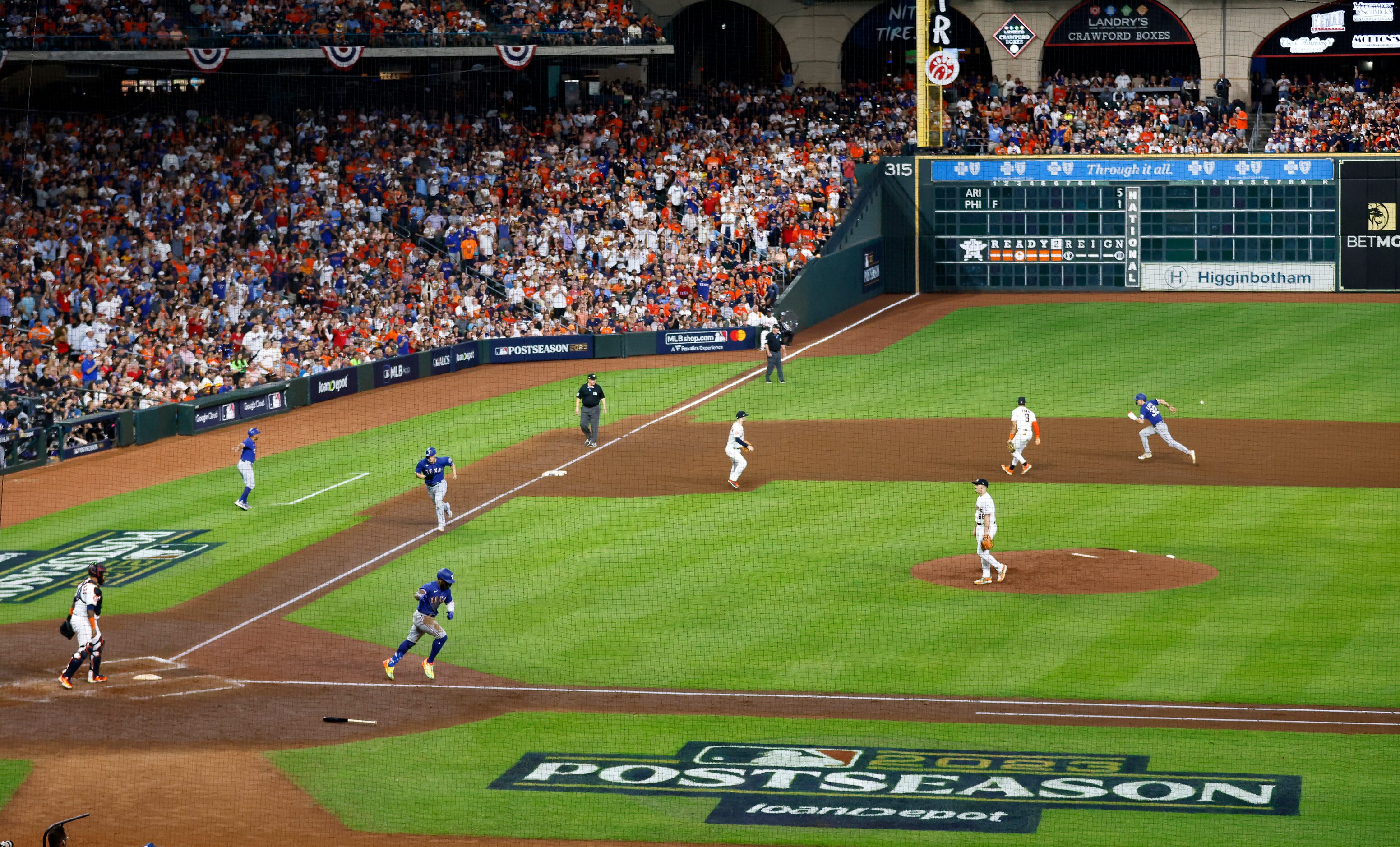 Texas Rangers right fielder Adolis Garcia (53) hits a two-RBI double to left field during...