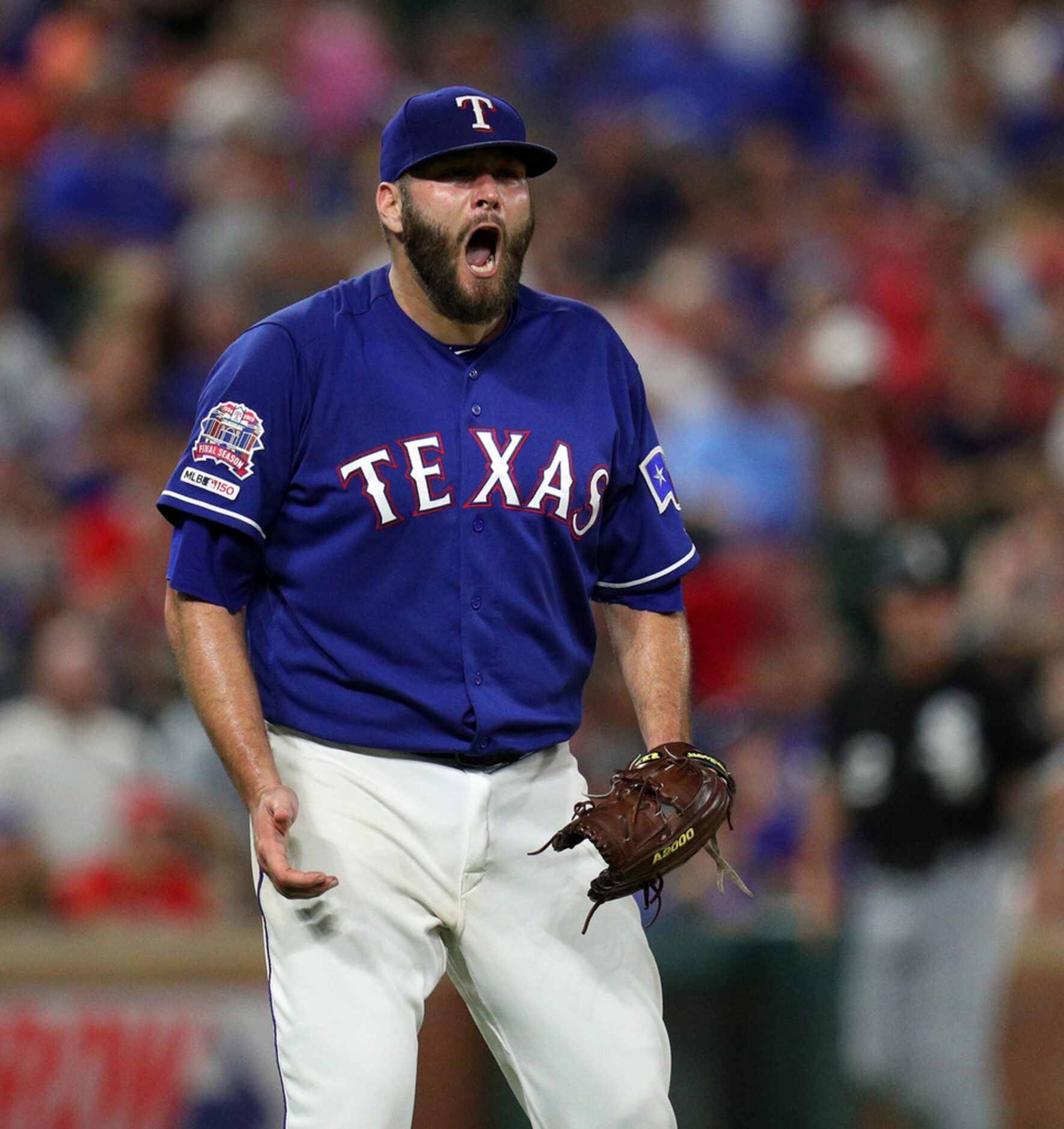 Texas Rangers starting pitcher Lance Lynn reacts after the final out in the top half of the...