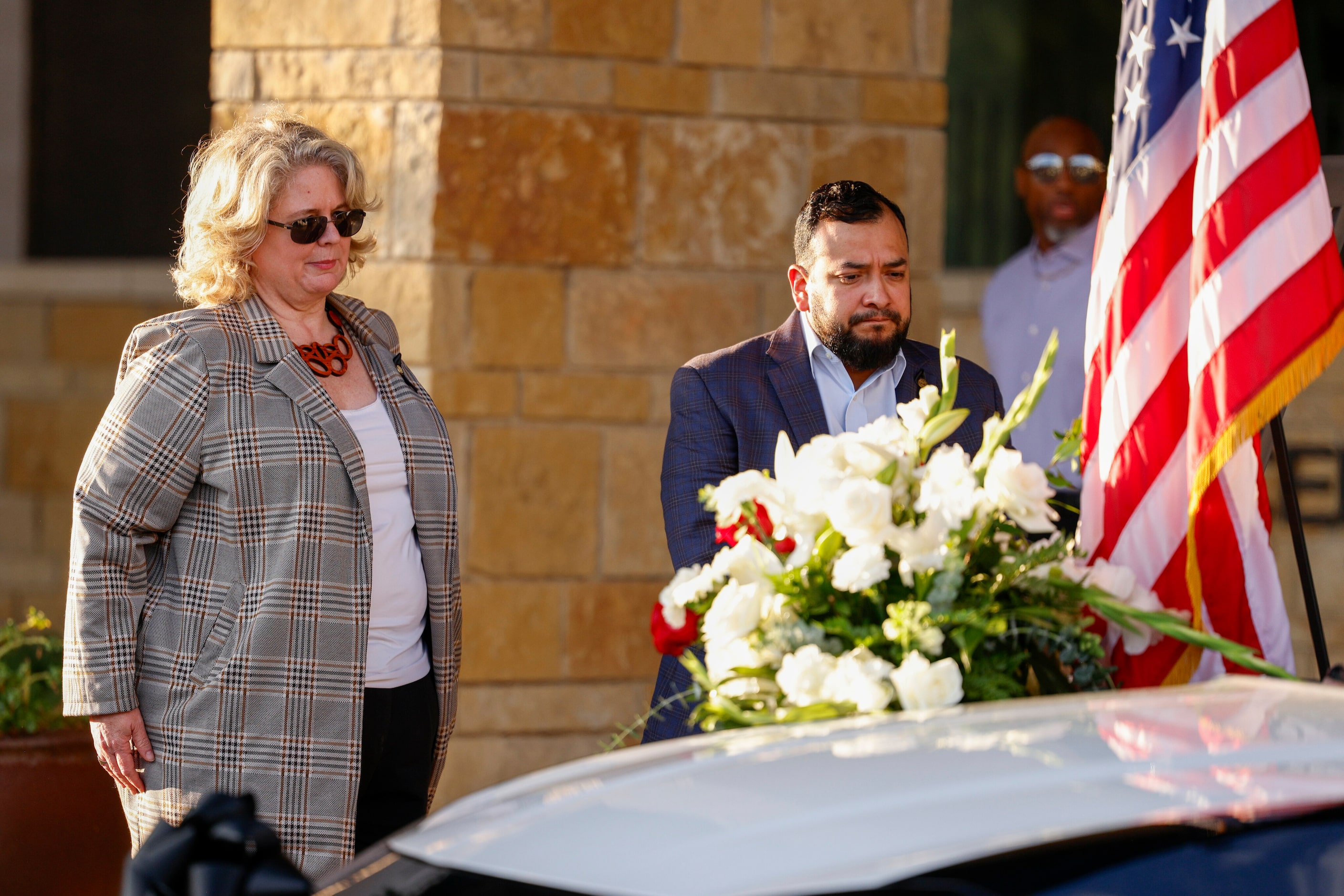 Dallas City Council members Cara Mendelsohn and Jesse Moreno pay their respects to a...