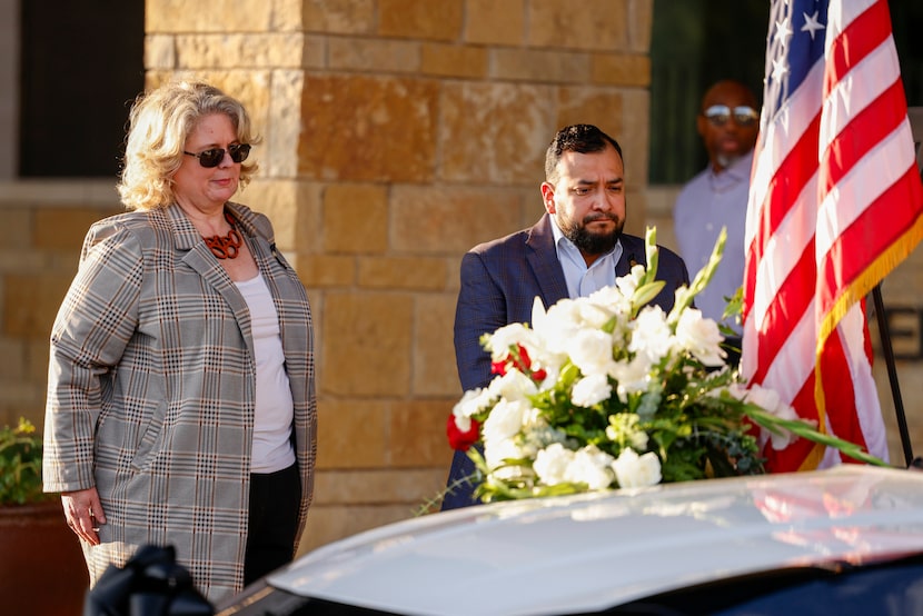 Dallas City Council members Cara Mendelsohn and Jesse Moreno pay their respects to a...