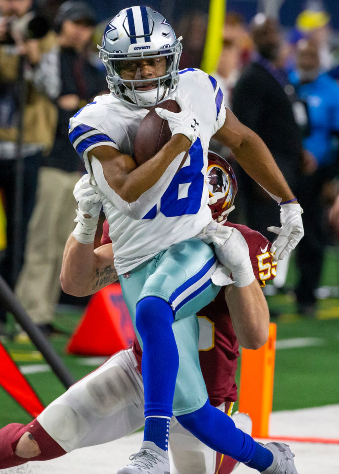 Washington Redskins linebacker Cole Holcomb (55) takes down Dallas Cowboys wide receiver...