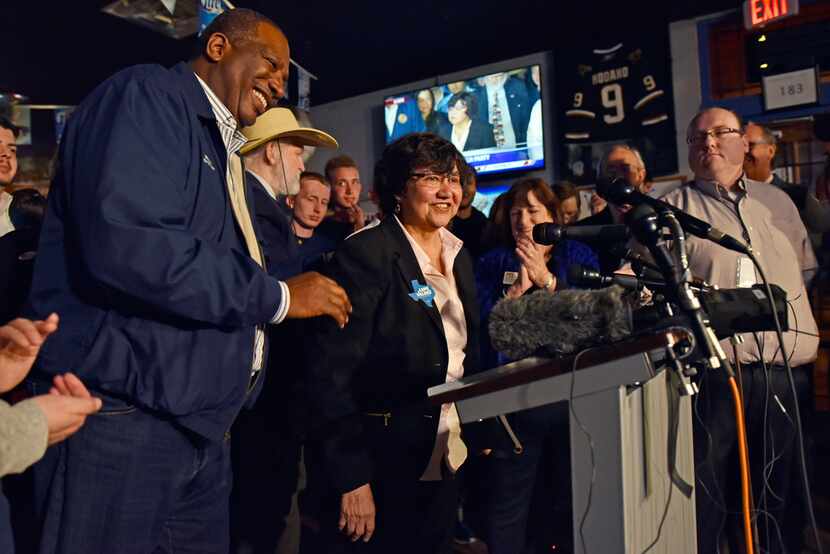 Sen. Royce West (left) congratulates candidate for governor Lupe Valdez as she speaks at an...