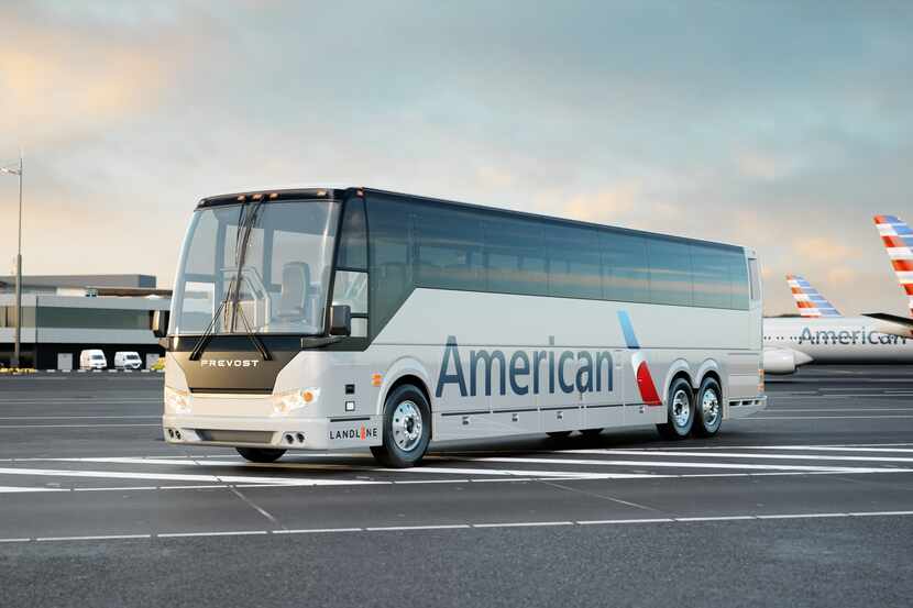 A Landline bus painted with the American Airlines logo that will transport customers between...