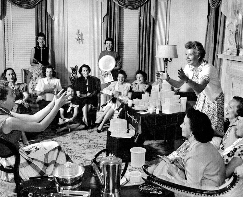 Brownie Wise as she tosses a bowl filled with water at a Tupperware party in the 1950s....