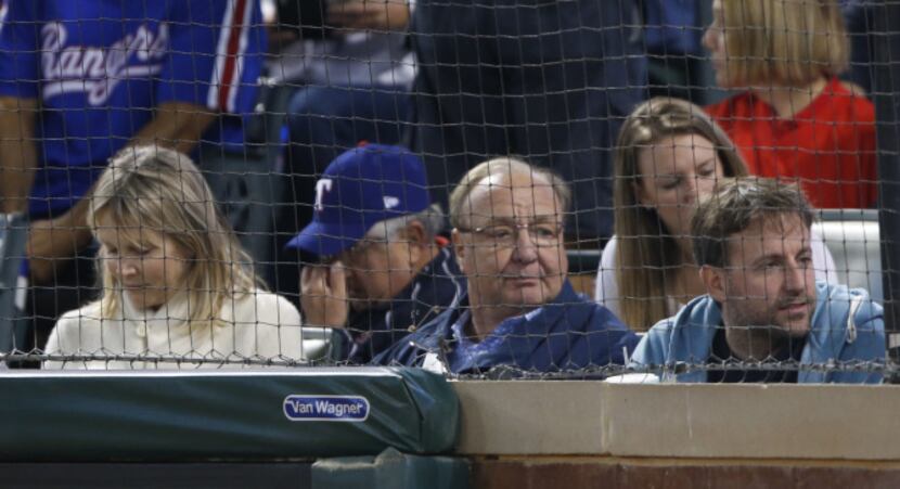 Former Texas Rangers owner Tom Hicks watches them play the Baltimore Orioles during their...