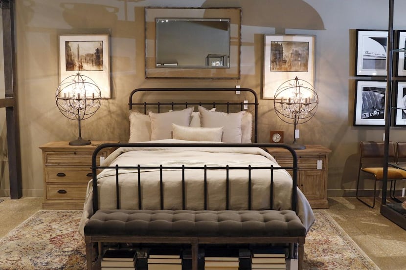 
A Winchester bed and Mariette tables are on display at Erdos at Home, a new furniture store...