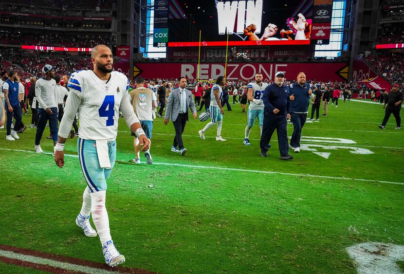 Dallas Cowboys quarterback Dak Prescott walks off the field after a 28-16 loss to the...