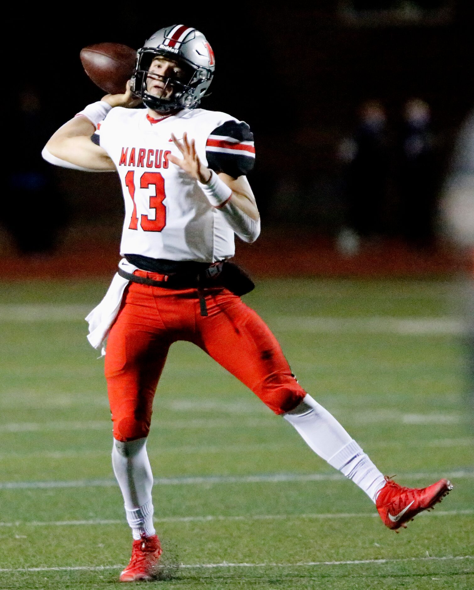 Flower Mound Marcus quarterback Garrett Nussmeier (13) throws a touchdown pass during the...