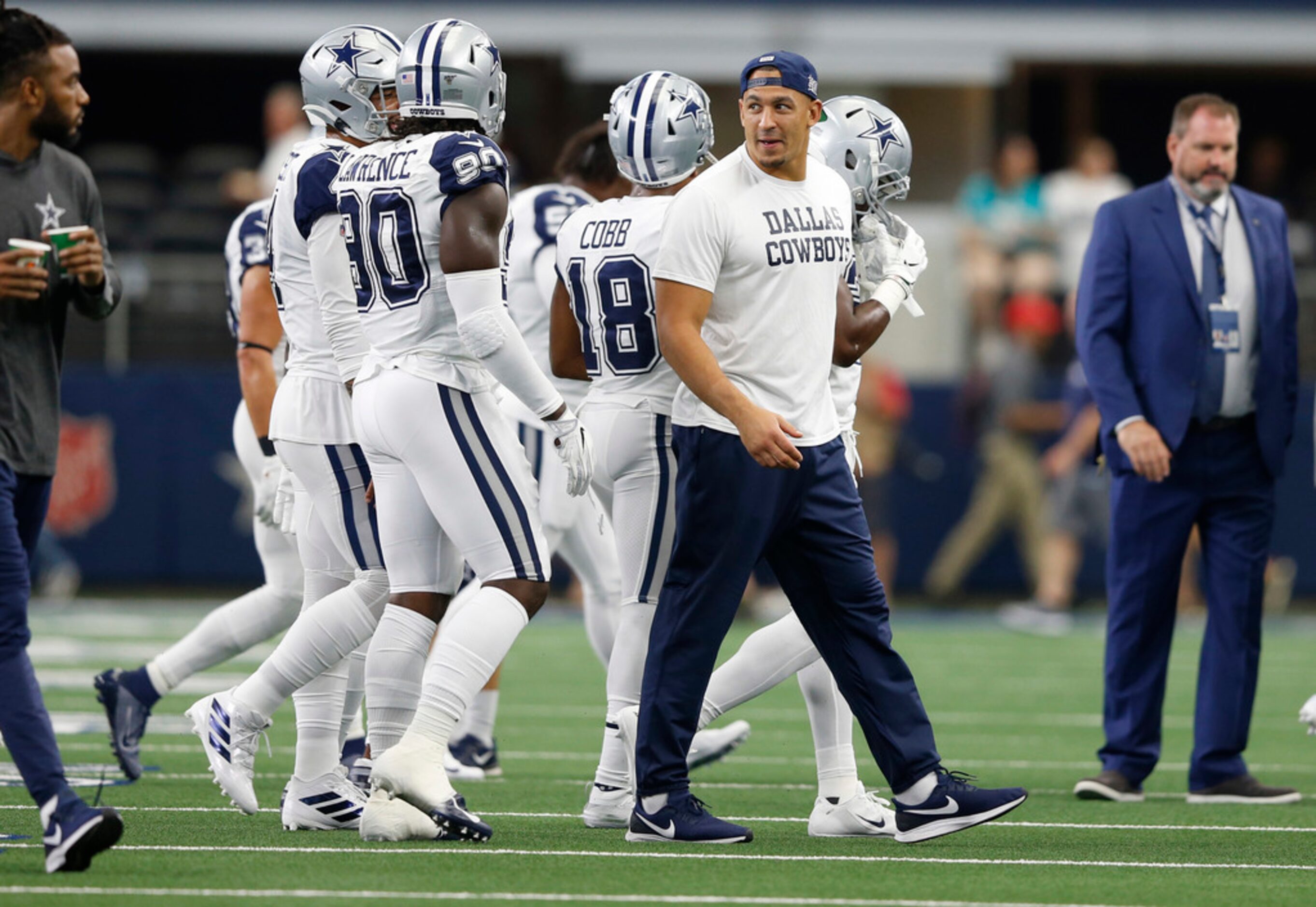 Dallas Cowboys defensive tackle Tyrone Crawford (98) looks back as the team exits the field...