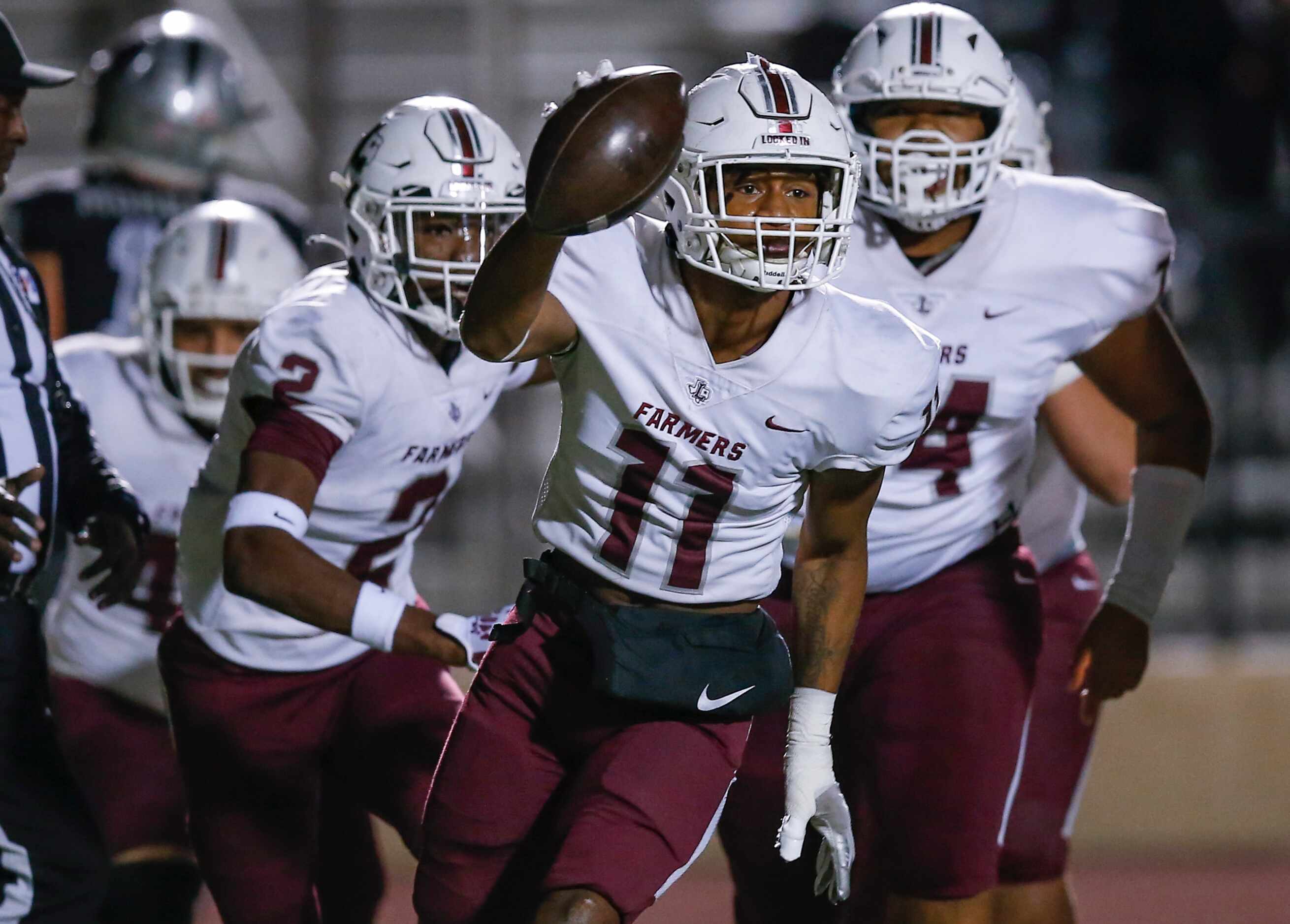 Lewisville senior defensive back Billy Sanford III (11) celebrates intercepting a Arlington...