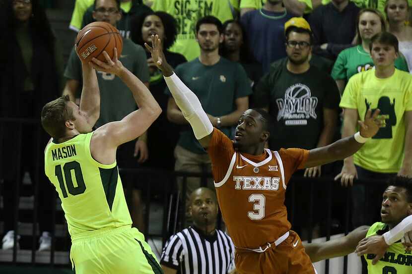 Baylor guard Makai Mason (10) shoots as Texas guard Courtney Ramey defends during the first...