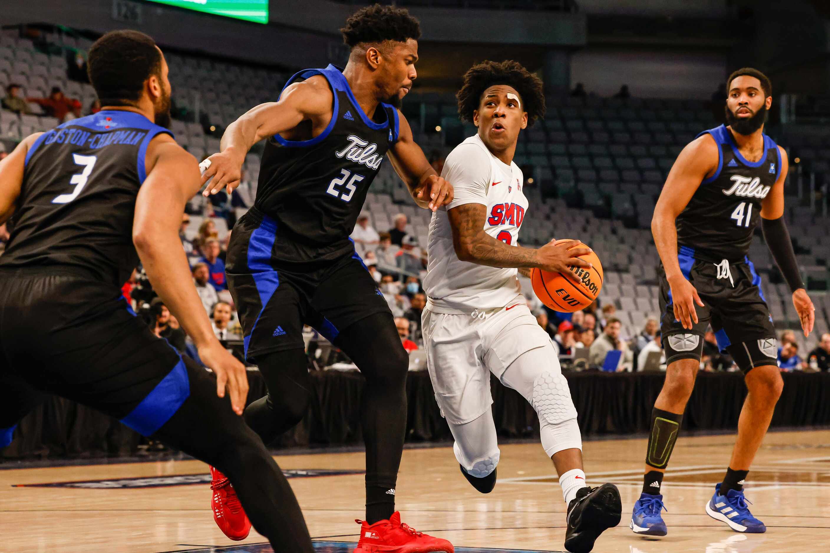 Southern Methodist Mustangs guard Kendric Davis (3) goes for a shot next to Tulsa Golden...