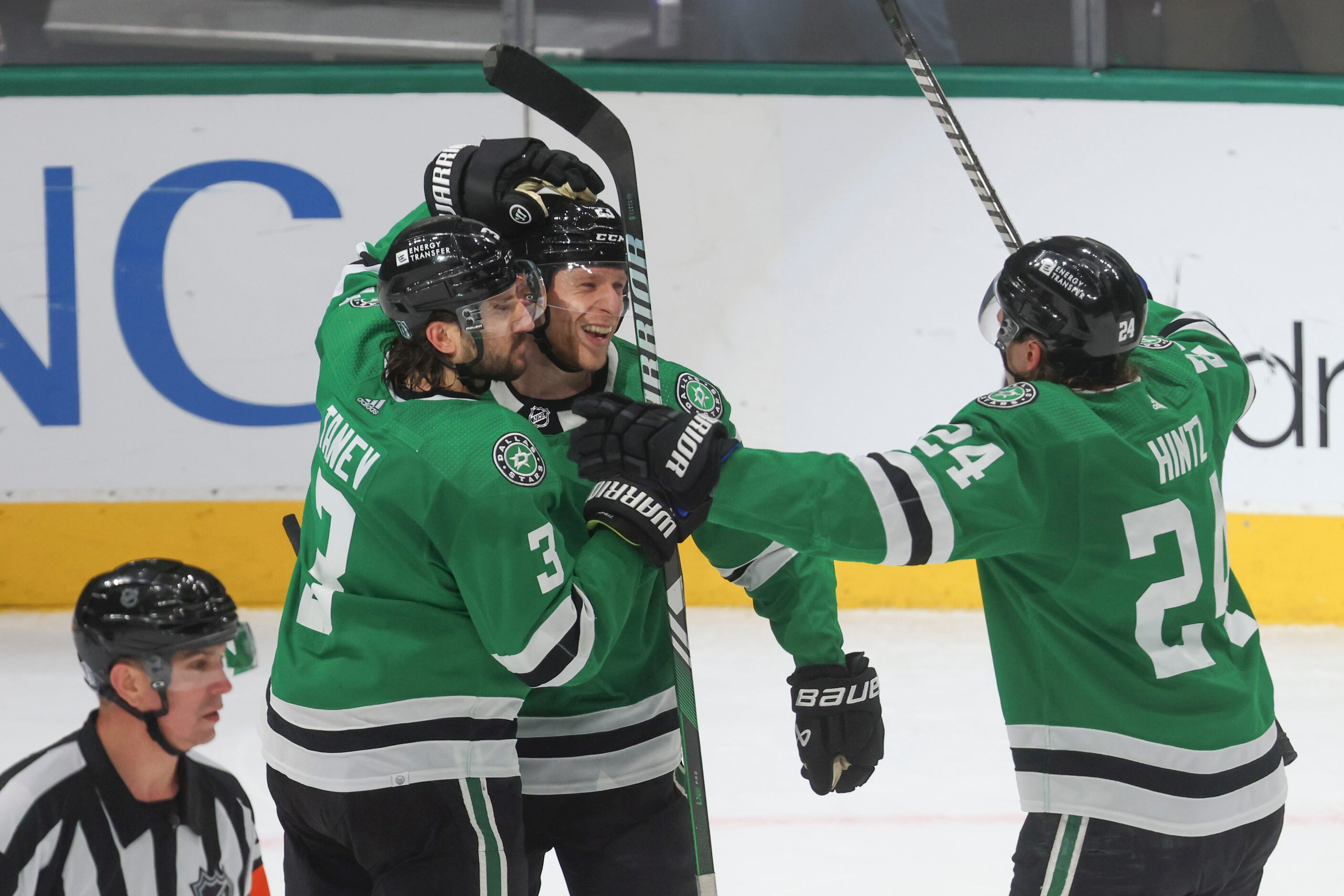 Dallas Stars defenseman Chris Tanev (left) and enter Roope Hintz (right) congratulates...