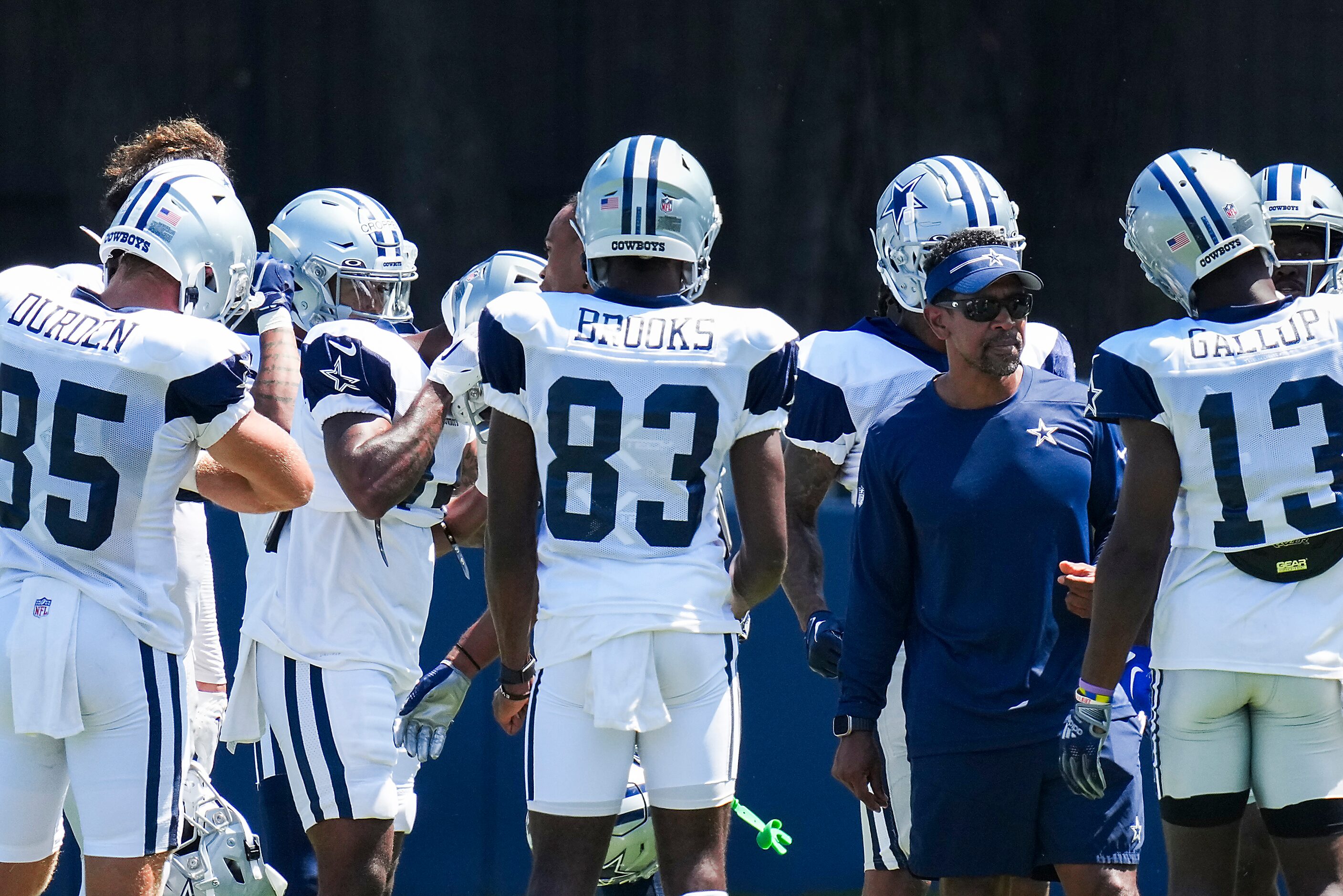 Dallas Cowboys wide receivers coach Robert Prince works with players, receiver David Durden...