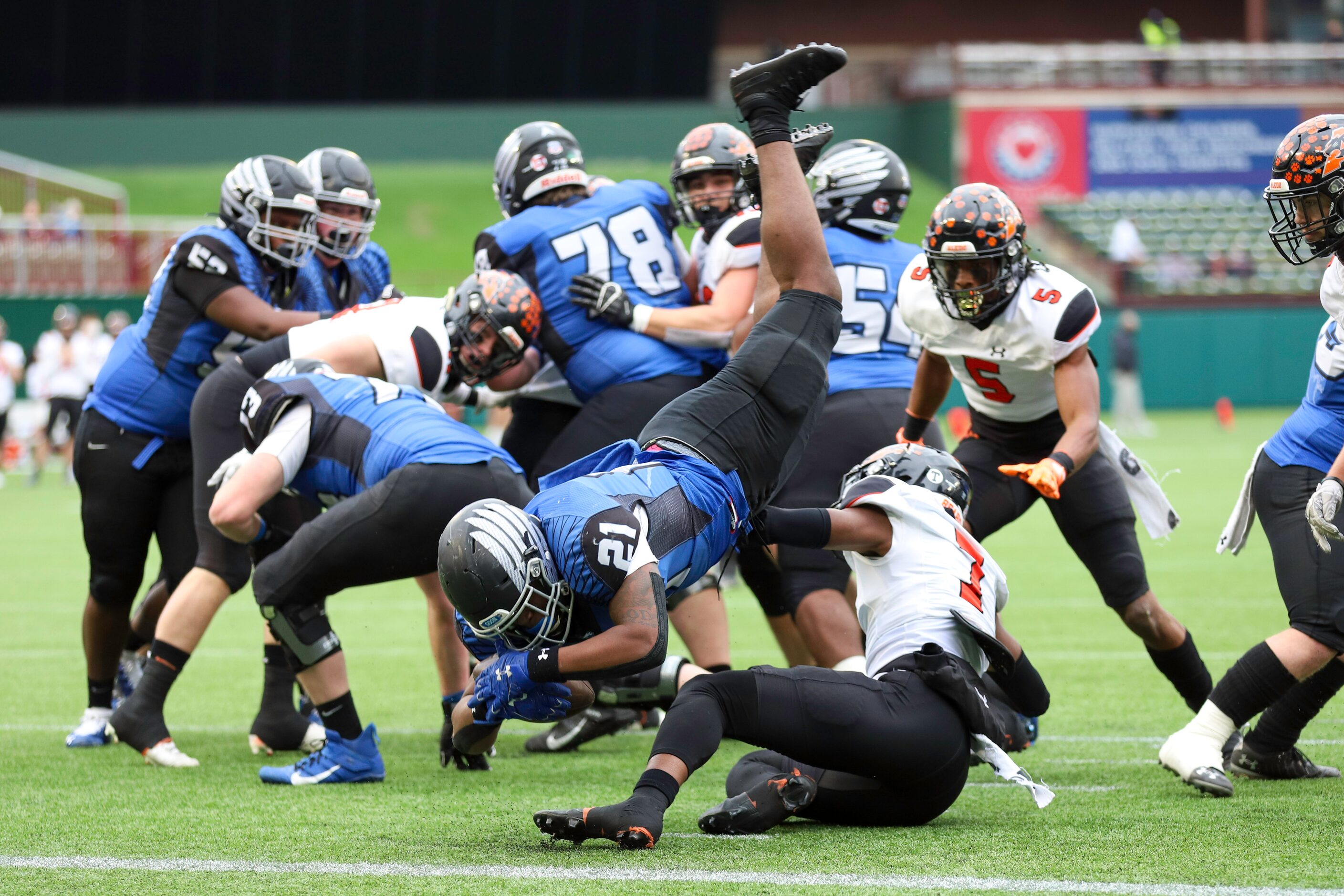 Aledo safety Bryan Allen (7) tackles North Forney running back Ty Collins (21) short of the...