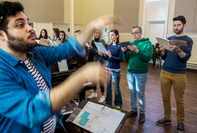 Verdigris Ensemble artistic director Sam Brukhman conducts his choral group at a rehearsal...