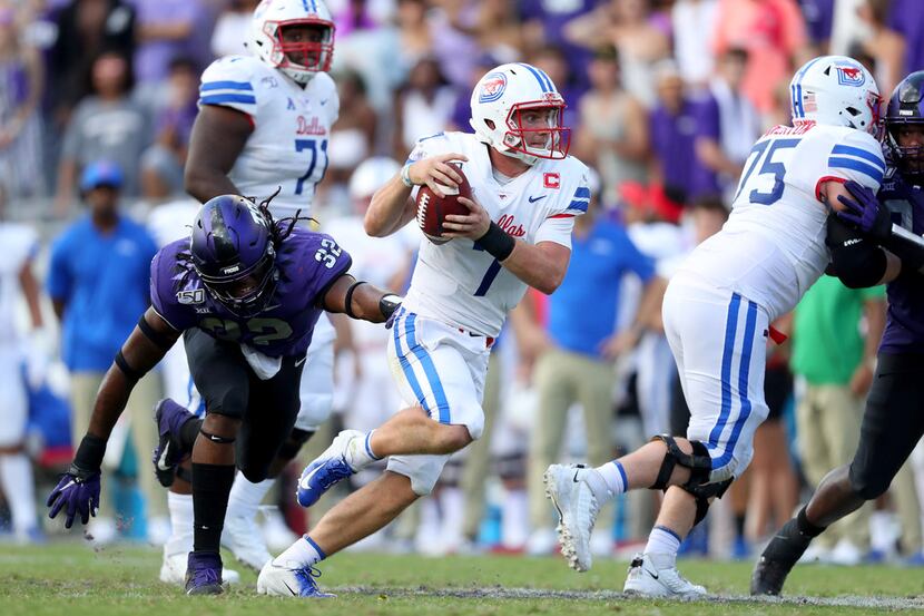 FORT WORTH, TEXAS - SEPTEMBER 21: Shane Buechele #7 of the Southern Methodist Mustangs...