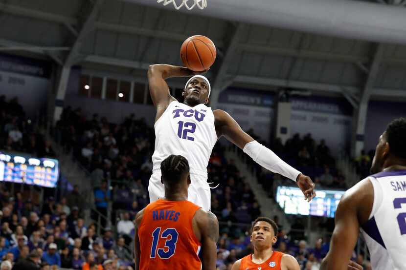 TCU forward Kouat Noi (12) of Australia goes up to attempt a dunk as Florida center...